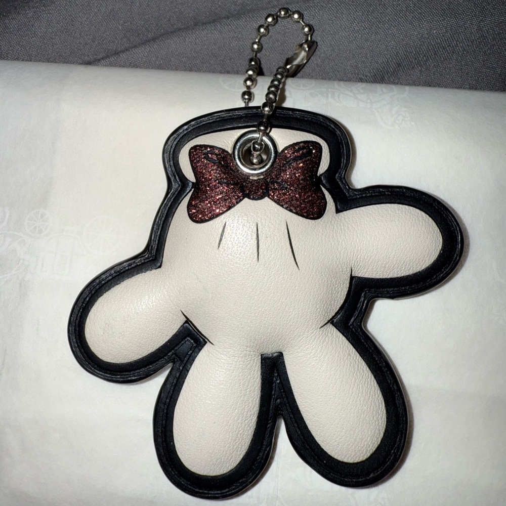 Coach Minnie Mouse glove bag charm.
